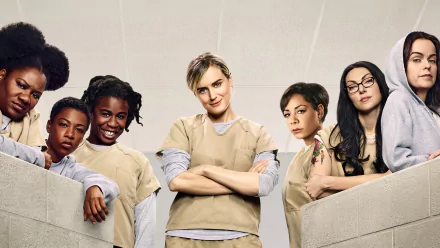 HD desktop wallpaper featuring cast members from the TV show Orange Is the New Black, showcasing the characters in their prison uniforms against a neutral background.