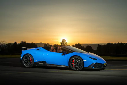 A vibrant blue Lamborghini Huracan supercar captured at sunset, showcased as a stunning 4K Ultra HD PC desktop wallpaper and background.