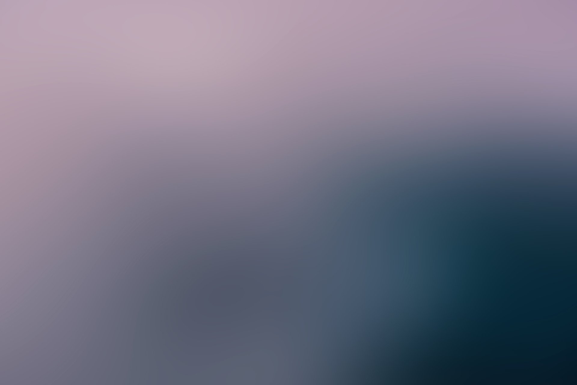 Abstract soft-blurred gradient from muted pink to deep teal — 2K Quad HD PC desktop wallpaper/background.