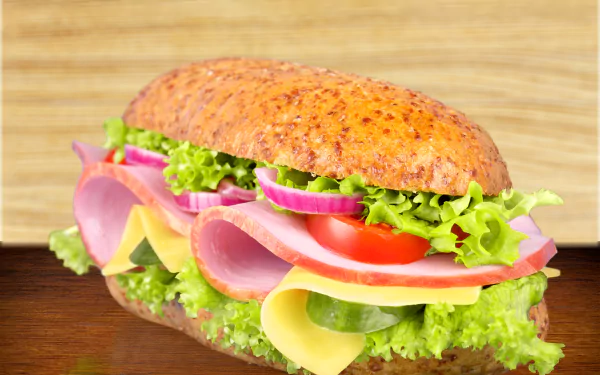A vibrant 4K Ultra HD desktop wallpaper featuring a fresh sandwich with layers of meat, cheese, lettuce, tomato, and onions on a seeded bread roll.