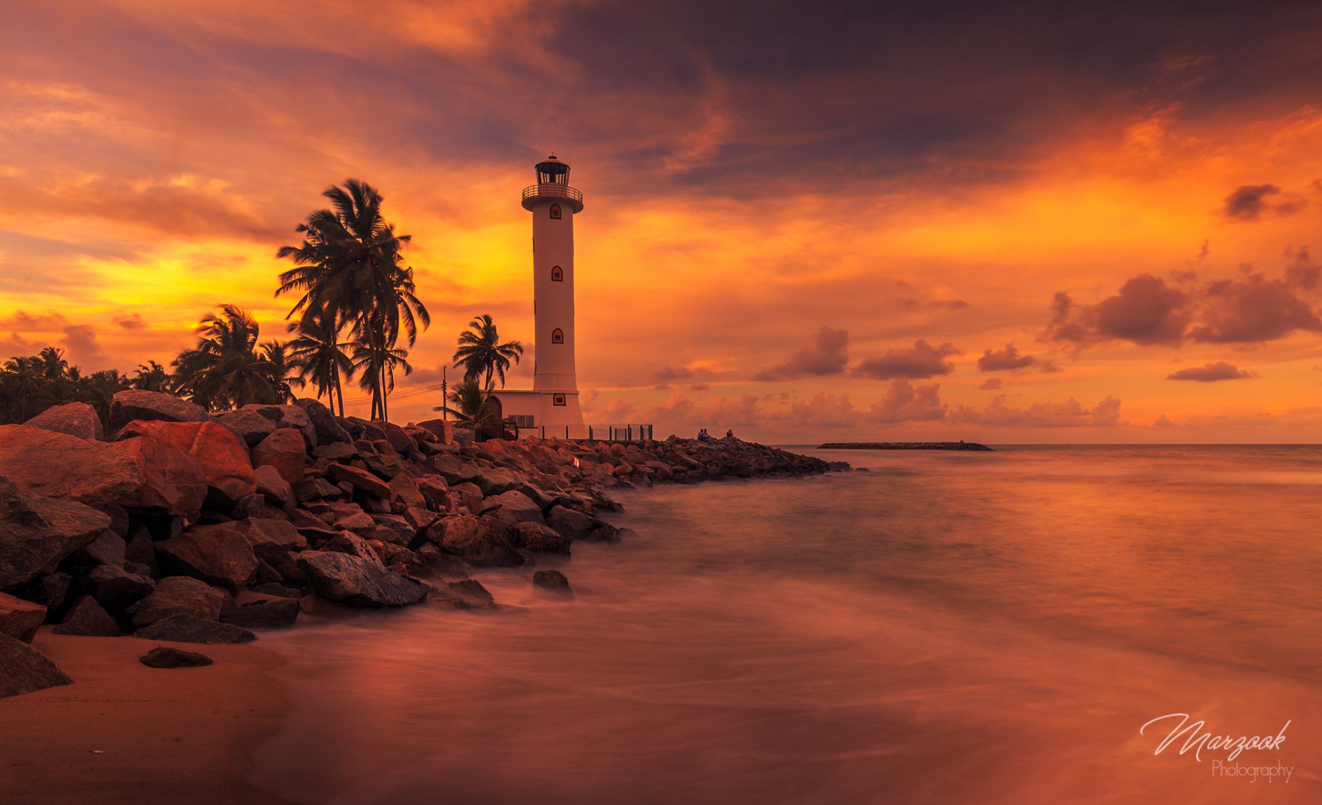 Lighthouse At Sunset By Marzook
