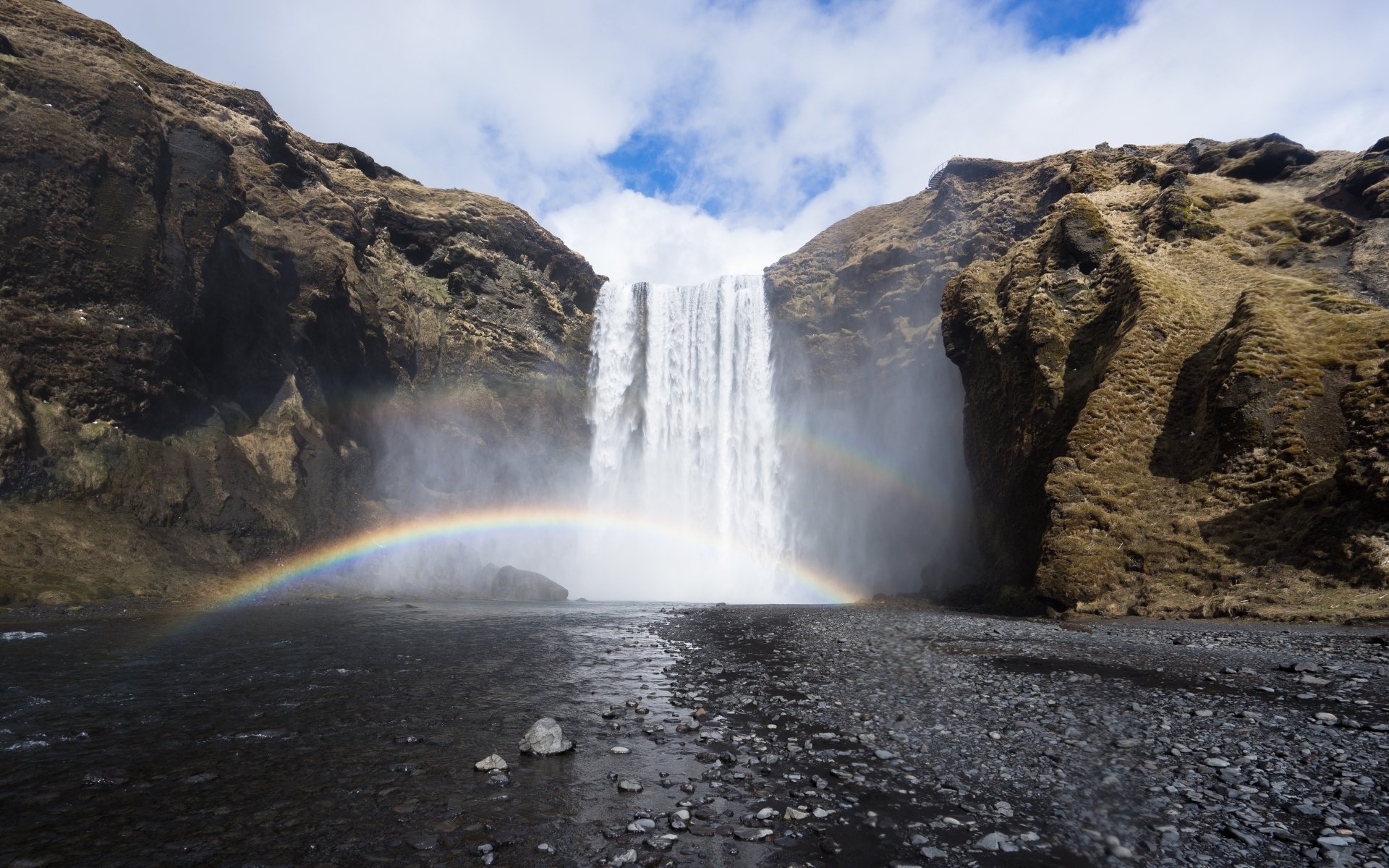 Waterfall with a rainbow by PhoModo