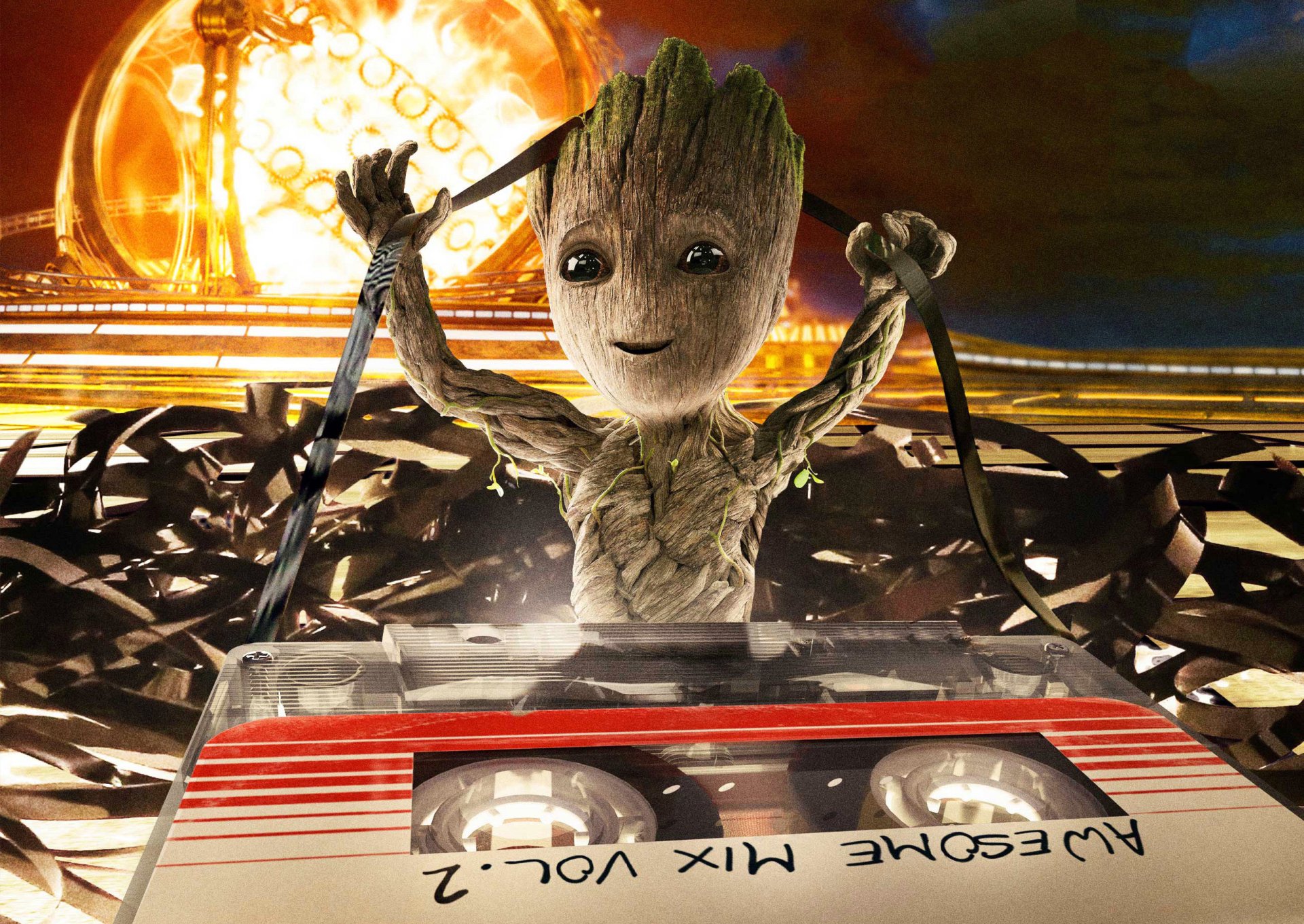 HD desktop wallpaper featuring Baby Groot from Guardians of the Galaxy Vol. 2 untangling a cassette tape labeled Awesome Mix Vol. 2, with a vibrant background.