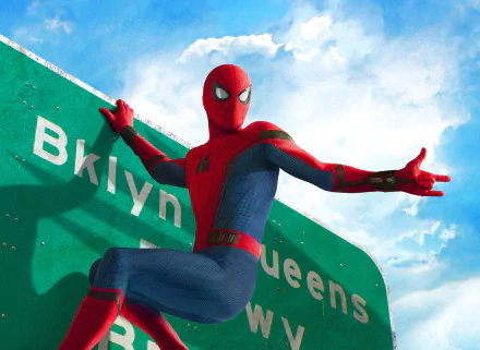 HD wallpaper of Spider-Man, portrayed by Tom Holland in Spider-Man: Homecoming, striking a dynamic pose against a green Brooklyn-Queens sign under a partly cloudy sky.