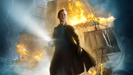 HD PC desktop wallpaper featuring Tintin from the movie The Adventures of Tintin, standing with a flashlight as a burning ship blazes in the background.