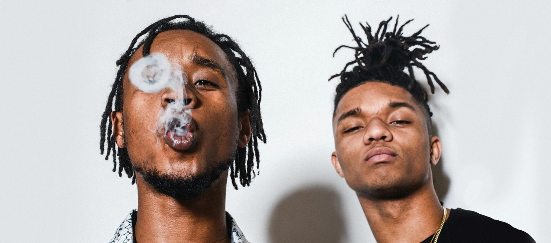 HD desktop wallpaper featuring Rae Sremmurd with one member blowing smoke rings.