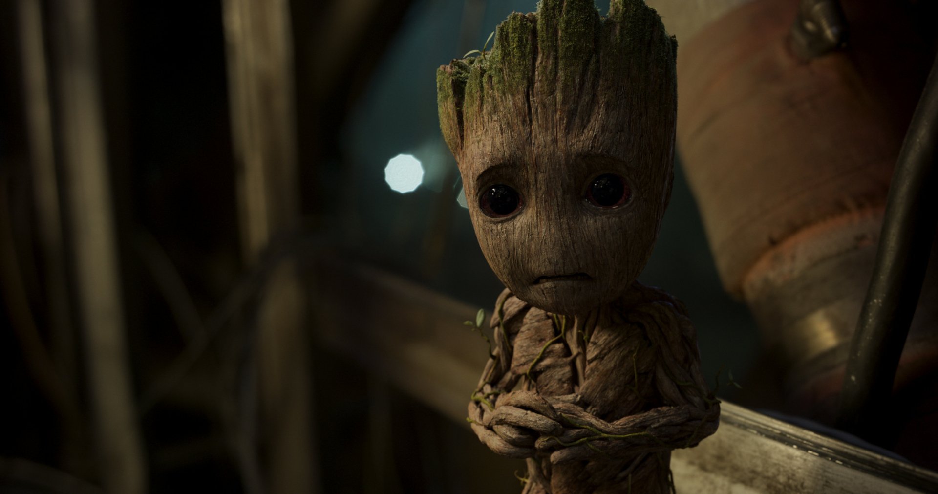 HD desktop wallpaper featuring Groot from the movie Guardians of the Galaxy Vol. 2, showcasing the character with a sad expression in a detailed, captivating background scene.