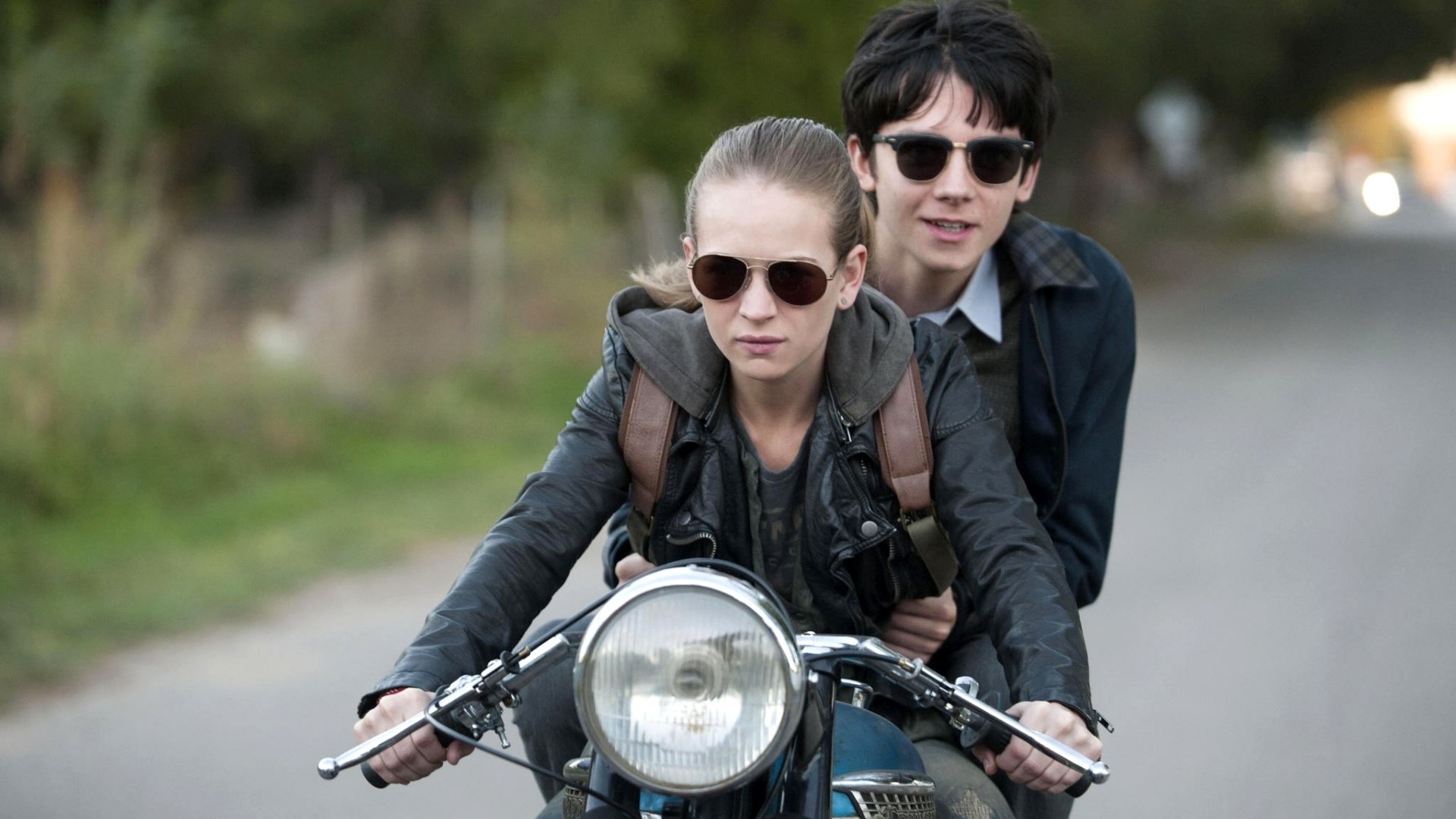 HD PC desktop wallpaper featuring Asa Butterfield and Britt Robertson riding a motorcycle, from the movie The Space Between Us.