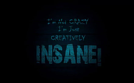 HD desktop wallpaper with a funny quote that reads, I'm not crazy, I'm just creatively INSANE! in bold, distressed blue text on a dark background.