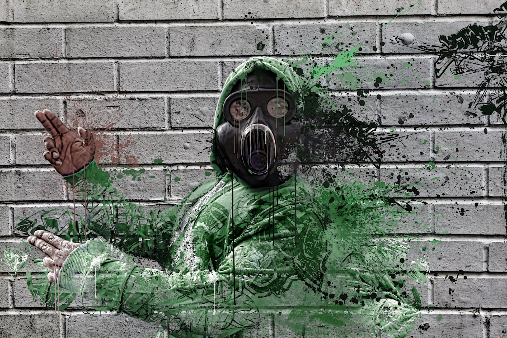 Graffiti-style hooded figure in a gas mask with green paint splatters on a brick wall — 5K Ultra HD PC desktop wallpaper/background.