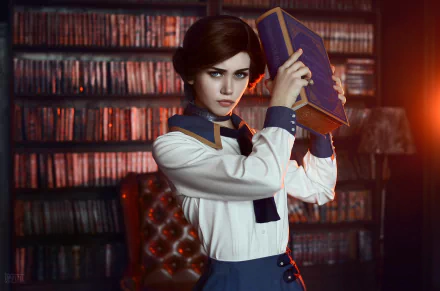 HD wallpaper featuring a brunette woman cosplaying Elizabeth from Bioshock Infinite, holding a book. She has blue eyes and stands in a dimly lit room with shelves of books in the background.