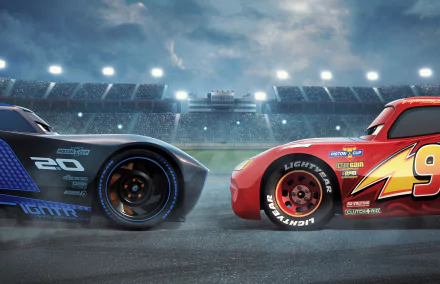 HD desktop wallpaper featuring a dramatic face-off between Jackson Storm and Lightning McQueen from the movie Cars 3, set in a lit stadium under a cloudy sky.