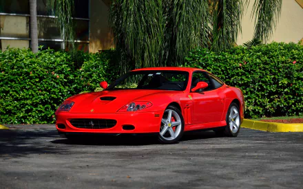 Red Ferrari 575M supercar vehicle parked in front of green hedges, captured as an HD PC desktop wallpaper and background.