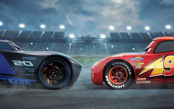HD desktop wallpaper featuring a dramatic face-off between Jackson Storm and Lightning McQueen from the movie Cars 3, set in a lit stadium under a cloudy sky.