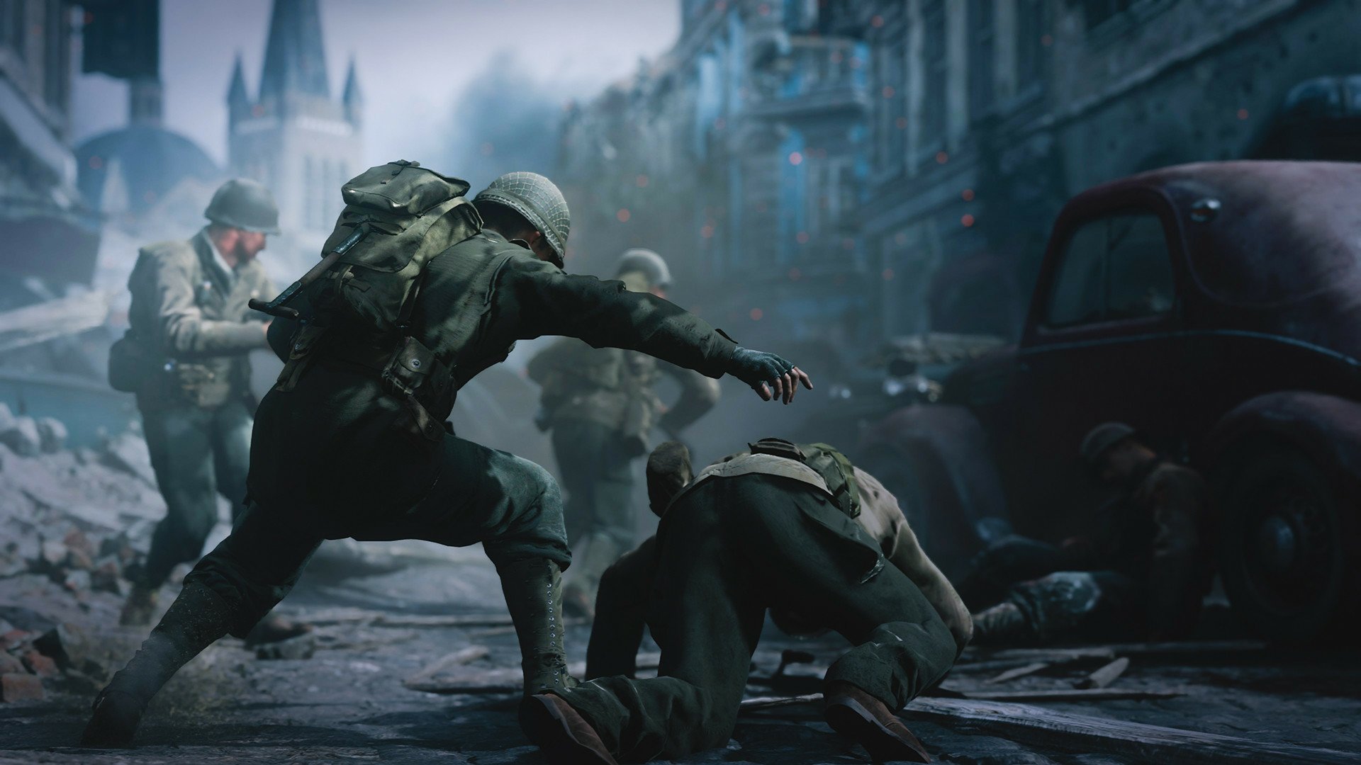 HD desktop wallpaper featuring a dramatic scene from the video game Call of Duty: WWII, with soldiers in an intense battle on a war-torn street.