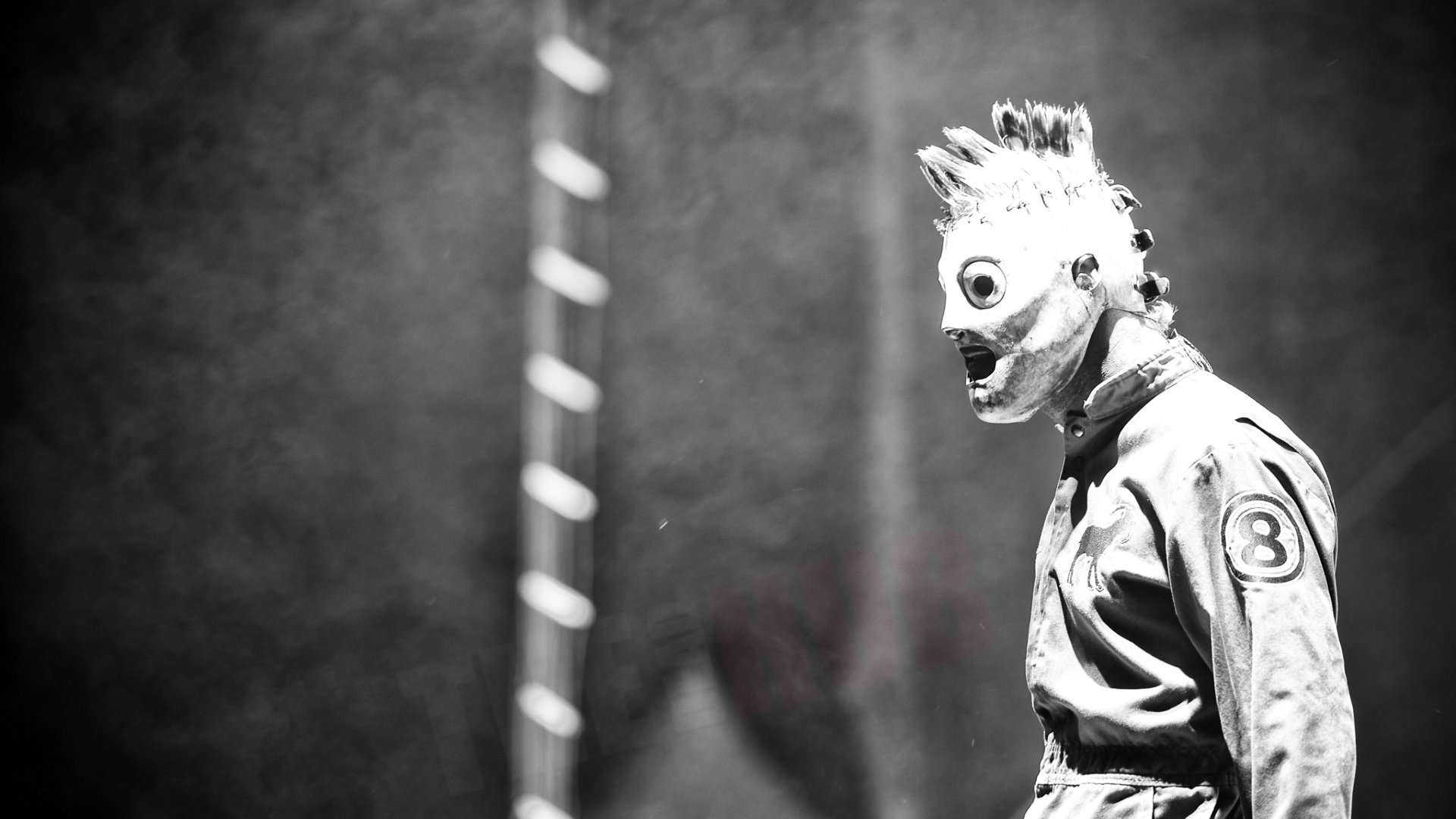 Black and white HD desktop wallpaper featuring a masked Slipknot member, embodying heavy metal, industrial metal, and nu metal music themes.