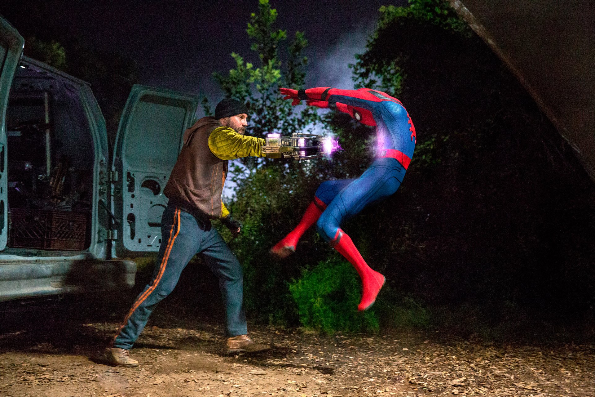 HD desktop wallpaper featuring Spider-Man in action from the movie Spider-Man: Homecoming, showcasing a dynamic nighttime battle scene.