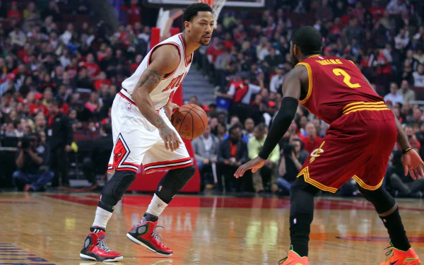 Derrick Rose dribbles the basketball during a game, showcasing his skills against an opponent. This dynamic scene captures the excitement of professional sports.