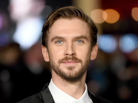 HD desktop wallpaper featuring a portrait of Dan Stevens with a blurred background.