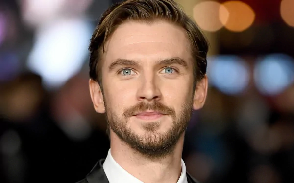 HD desktop wallpaper featuring a portrait of Dan Stevens with a blurred background.