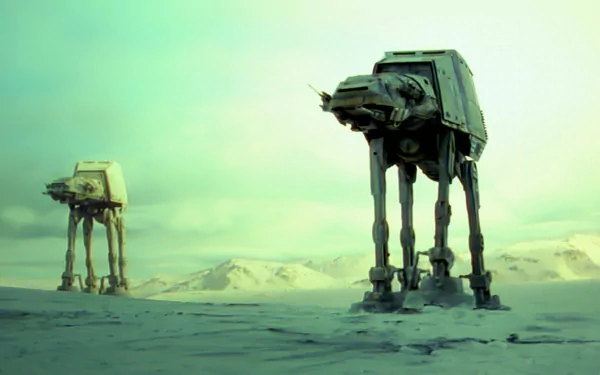 HD Star Wars desktop wallpaper featuring two AT-AT Walkers on the icy plains of Hoth, capturing an iconic scene from the movie.