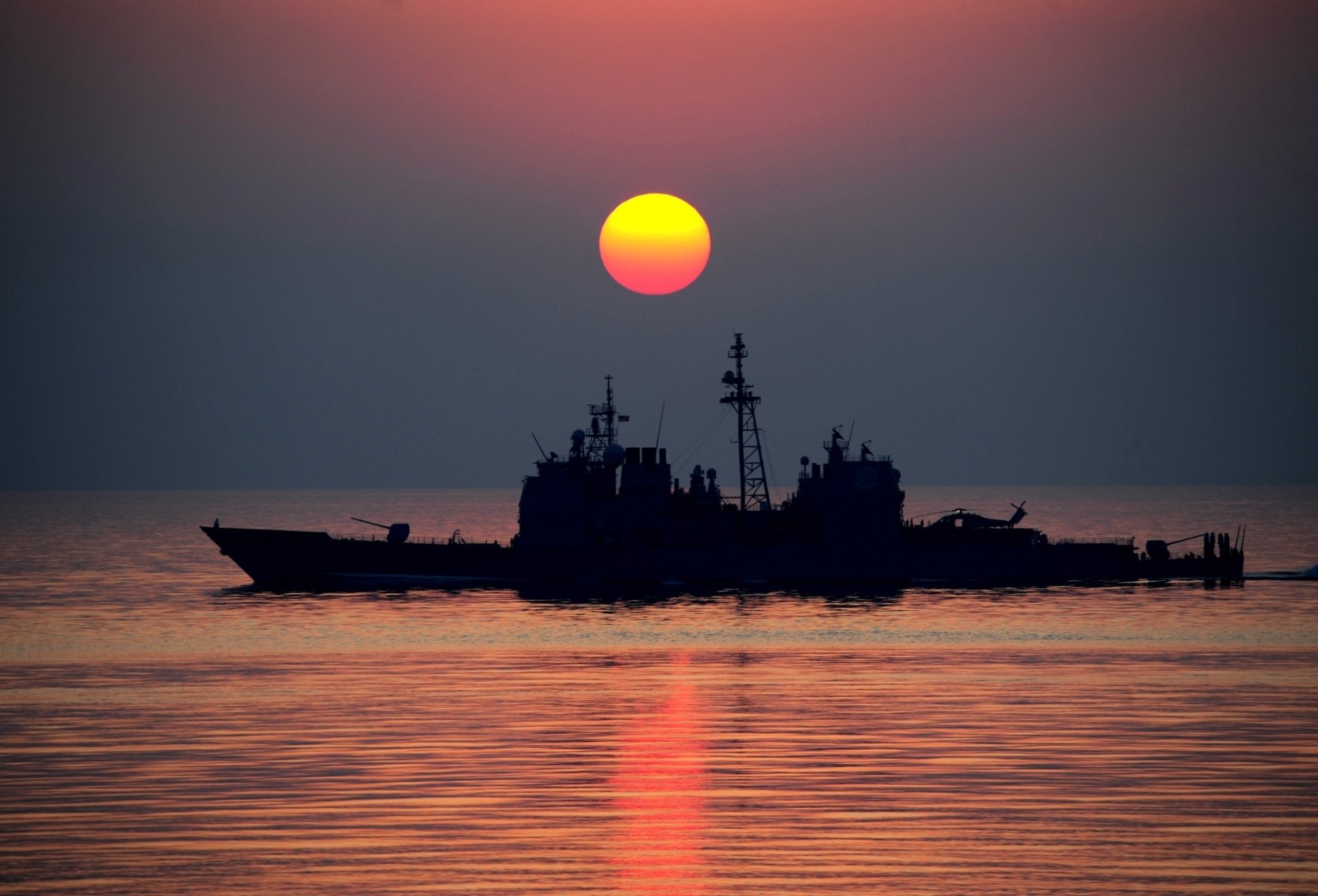 USS Mobile Bay at Sunset: Silhouette of a Guided Missile Cruiser 