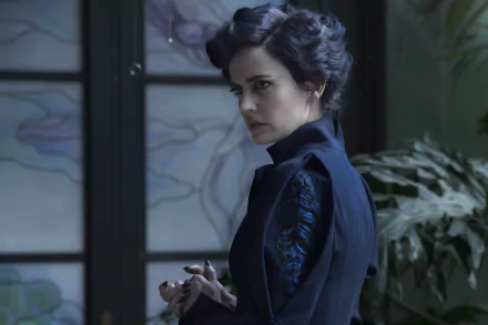 Eva Green as Miss Peregrine, in the movie Miss Peregrine's Home for Peculiar Children. She stands in front of a stained glass window, in a HD desktop wallpaper and background.