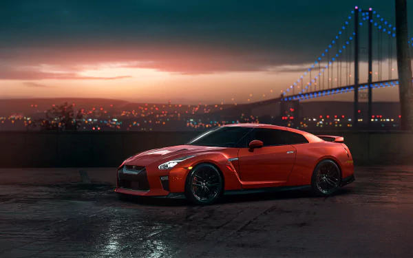 A vibrant orange Nissan GT-R supercar is parked on a wet surface with a city skyline and illuminated bridge in the background, captured in HD for a desktop wallpaper.