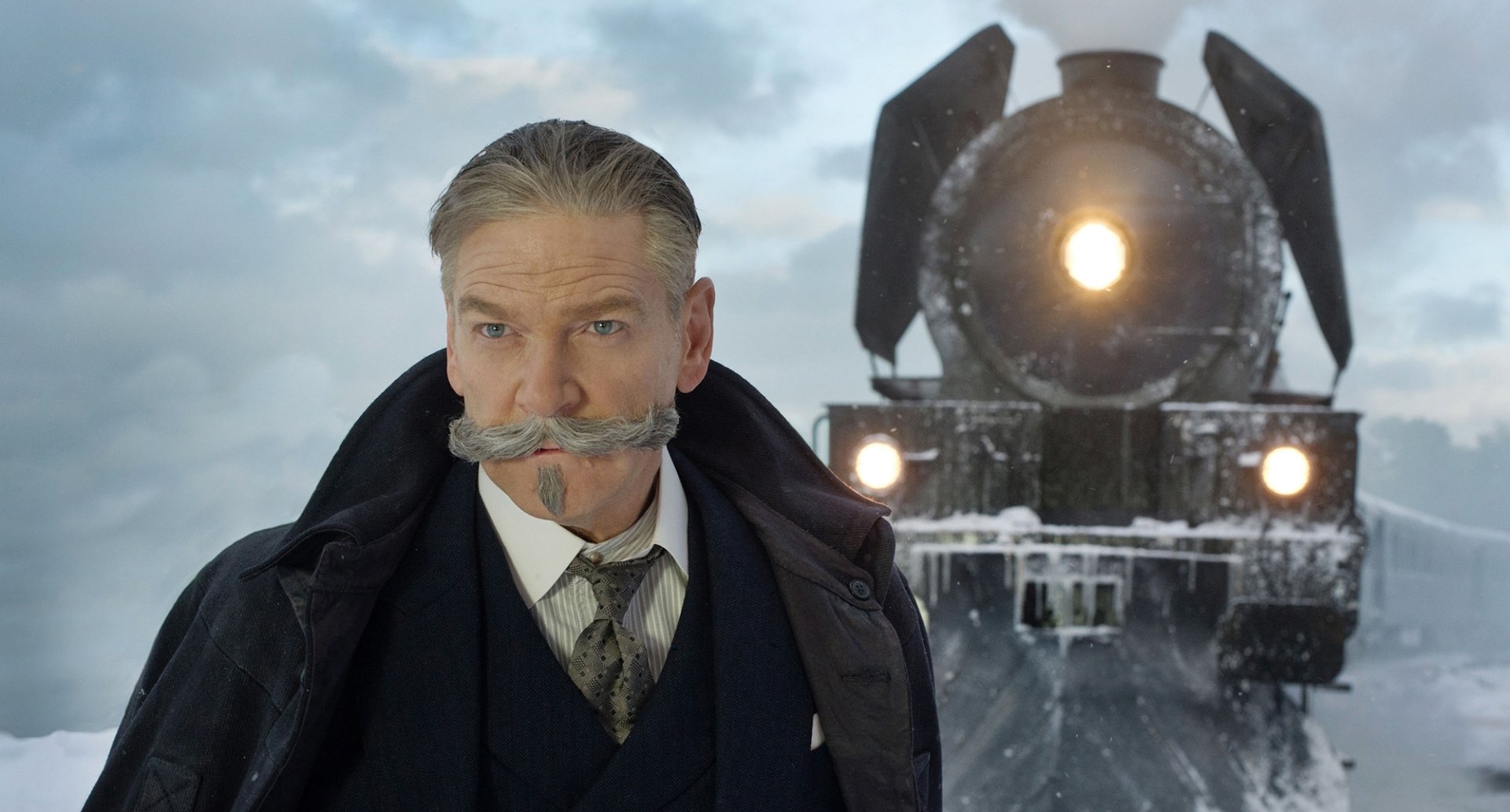 HD desktop wallpaper and background featuring Kenneth Branagh in character from the movie Murder on the Orient Express (2017), standing in front of a snow-covered train.