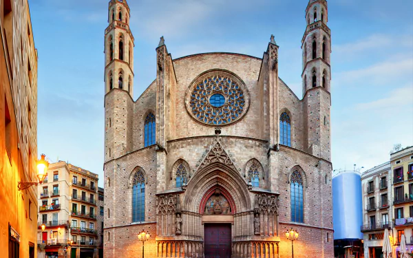 4K Ultra HD image of Santa Maria del Mar cathedral in Barcelona, Spain, showcasing its gothic architecture and religious significance against a clear sky backdrop.