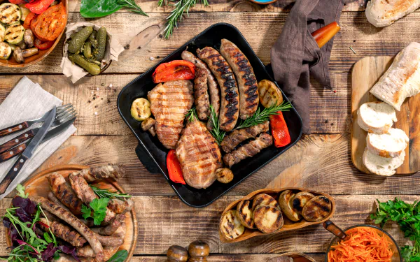 A 4K Ultra HD still life of grilled sausages, meat, and vegetables arranged on a rustic wooden table, showcasing rich colors and textures in a vibrant food display.