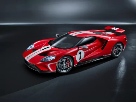A vibrant red Ford GT supercar with racing stripes and number 1, showcased as a sleek 4K Ultra HD desktop wallpaper and background.