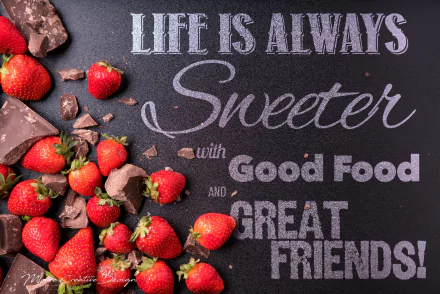 HD desktop wallpaper featuring a motivational statement with strawberries and chocolate, highlighting the sweetness of life with good food and great friends.