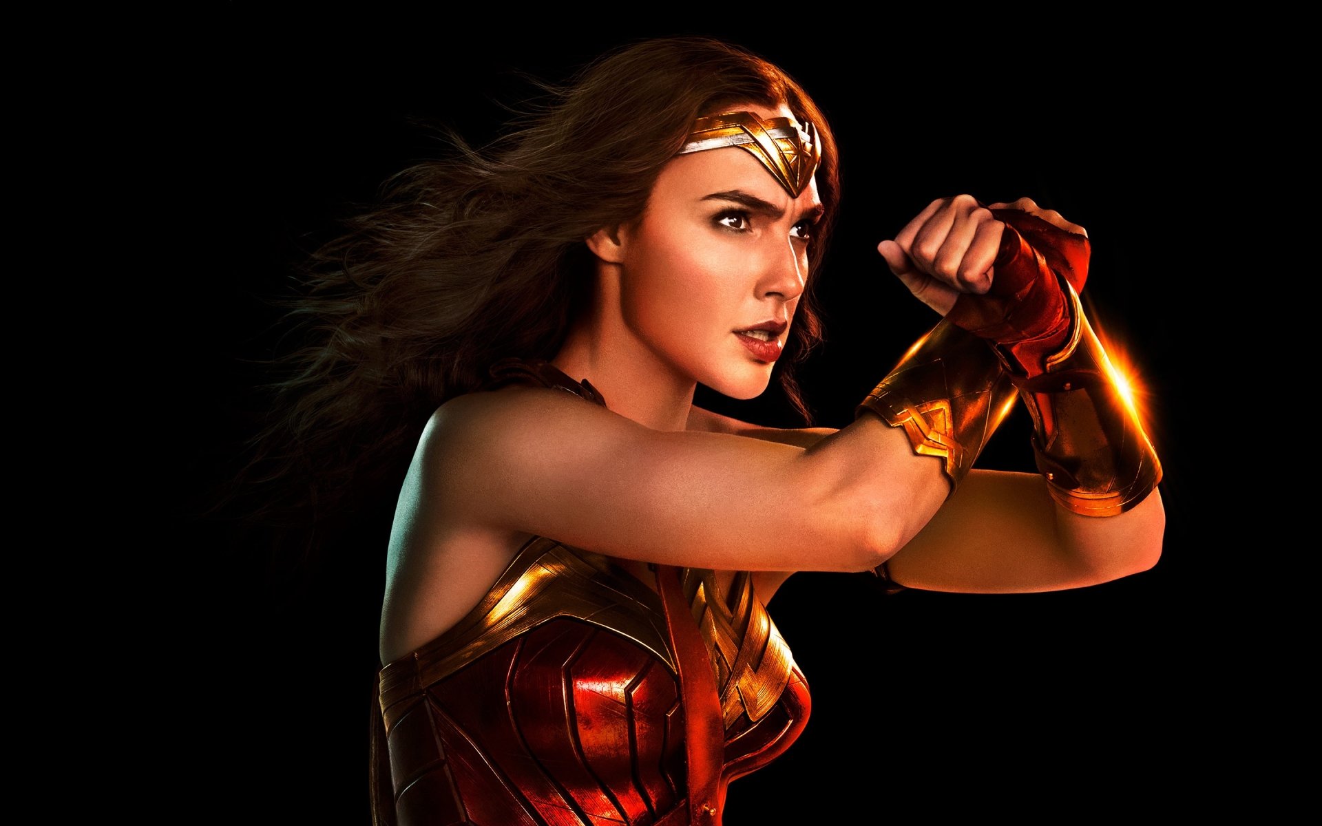 HD desktop wallpaper featuring Gal Gadot as Wonder Woman in the 2017 Justice League movie, showcasing her iconic warrior pose against a dark background.