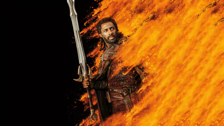 HD desktop wallpaper featuring Idris Elba as Heimdall from Marvel's Thor: Ragnarok, standing with a sword amidst fiery flames.