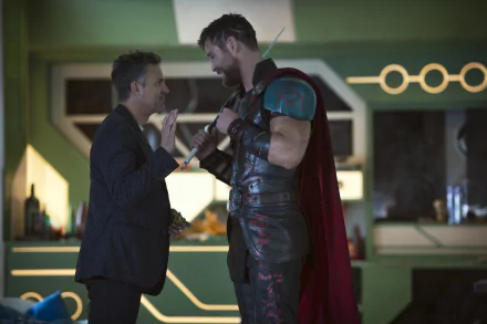 HD desktop wallpaper of Thor: Ragnarok with Chris Hemsworth as Thor and Mark Ruffalo as Bruce Banner in an intense moment from the movie.