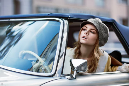 Blonde Russian model Anastasiya Scheglova wearing a hat, posing inside a classic car in this HD PC desktop wallpaper and background.