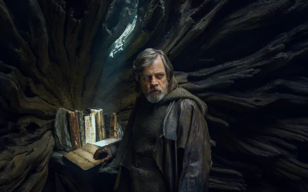 Mark Hamill as Luke Skywalker stands in a mystical setting, surrounded by ancient books, from Star Wars: The Last Jedi, captured in stunning 4K Ultra HD quality.