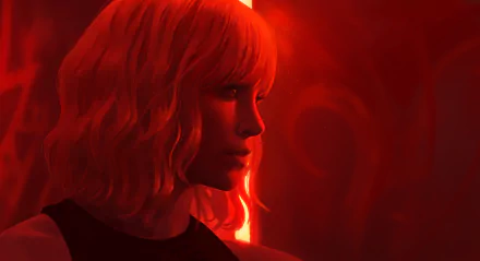 Charlize Theron in a red-lit scene from the movie Atomic Blonde, rendered as a 4K Ultra HD PC desktop wallpaper.