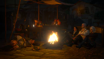HD desktop wallpaper from The Witcher 3: Wild Hunt featuring Yennefer of Vengerberg, Ciri, and Geralt of Rivia sitting around a campfire at night in a cozy medieval setting.
