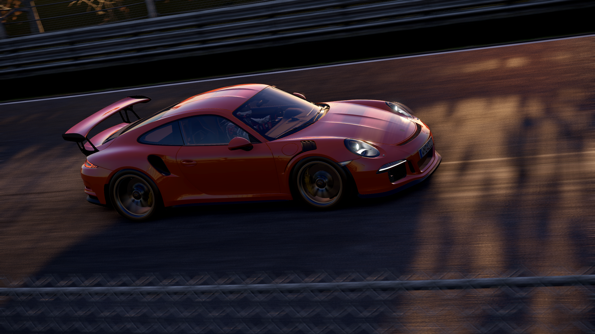 Red Porsche 911 racing on a track in the video game Project Cars 2, rendered in 4K Ultra HD for a PC desktop wallpaper and background.