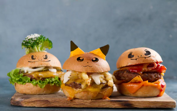 4K Ultra HD PC wallpaper featuring three creative Pokemon-themed burgers with vibrant toppings on a wooden board against a soft gray background.