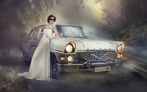 A fashionable woman in a white gown poses confidently beside a vintage car on a misty road, capturing a stylish blend of elegance and classic automotive design for an HD desktop wallpaper.