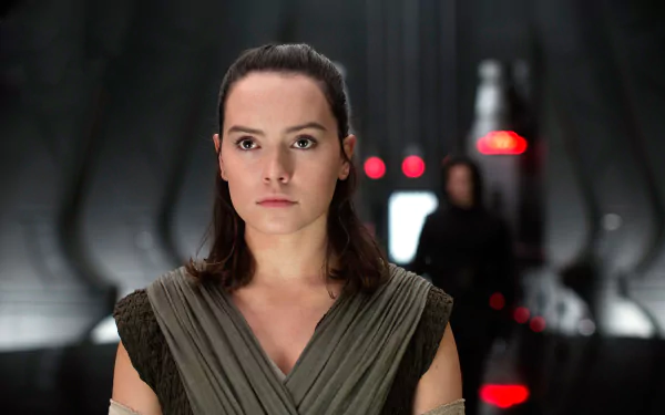 HD PC desktop wallpaper featuring Daisy Ridley as Rey from Star Wars: The Last Jedi, set in a dimly lit, futuristic corridor.
