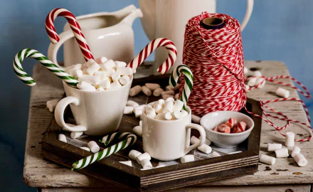 HD desktop wallpaper of candy canes and marshmallows in cups, with sweets, a pitcher, and red-and-white twine on a wooden tray in a cozy still life food setting.