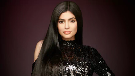 Portrait of a brunette celebrity model with brown eyes, Kylie Jenner, in a black sequined outfit against a dark background, captured in 4K Ultra HD quality.