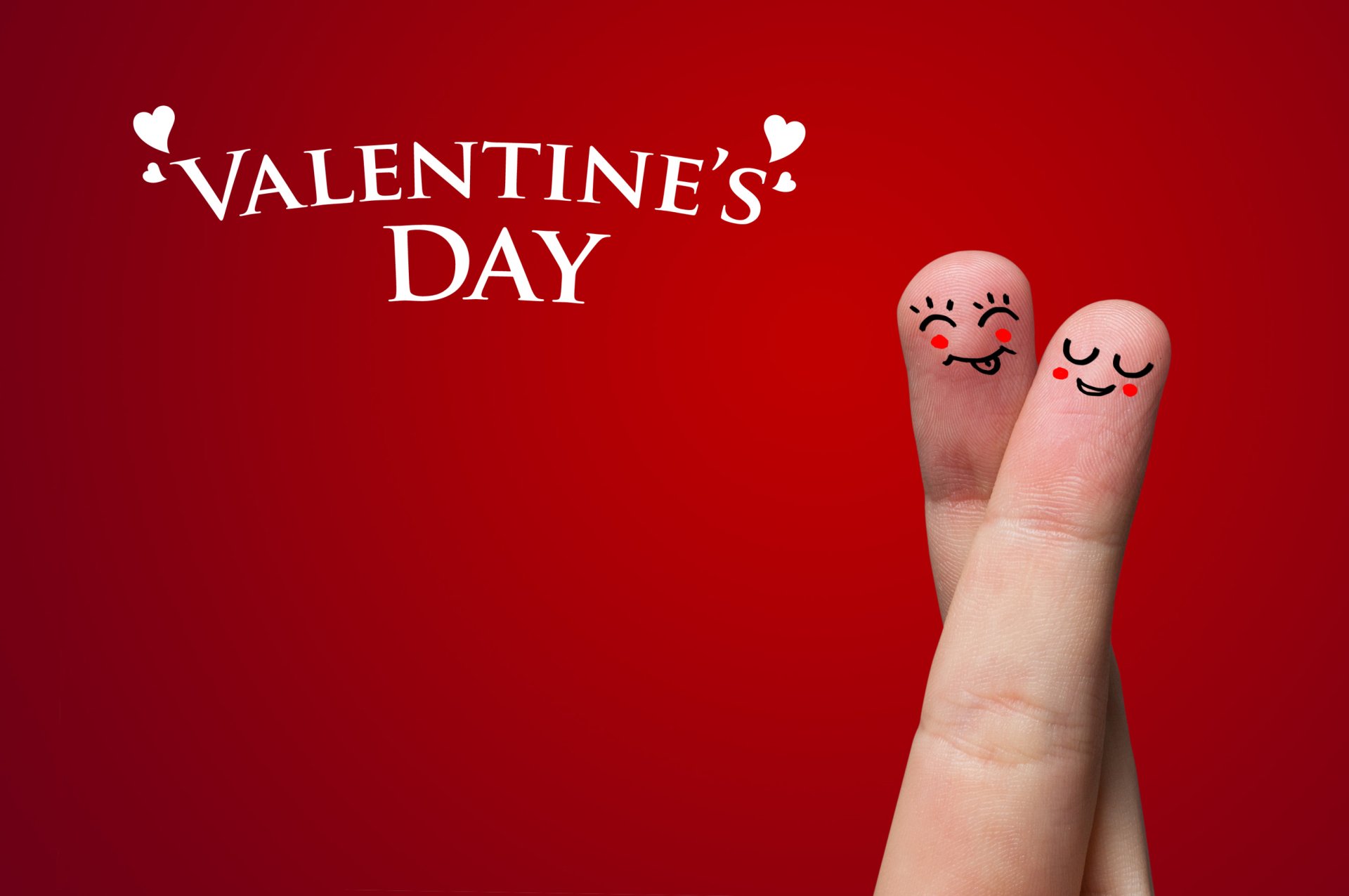HD desktop wallpaper featuring two fingers with happy faces against a red background, celebrating Valentine's Day.
