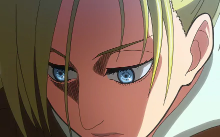 HD desktop wallpaper featuring Annie Leonhart from the anime Attack on Titan, with a close-up view of her intense expression and blue eyes.
