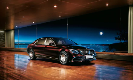 A sleek Mercedes-Benz S-Class car is showcased in a modern, dimly lit room with large windows and a scenic nighttime view, rendered in 4K Ultra HD quality.