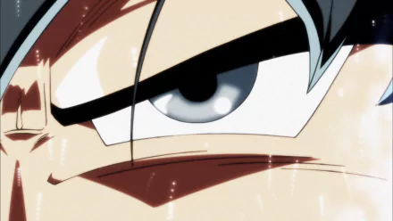 HD desktop wallpaper featuring an intense close-up of Goku's eye in Ultra Instinct mode from Dragon Ball Super. Sparkling light effects enhance the captivating anime artwork.